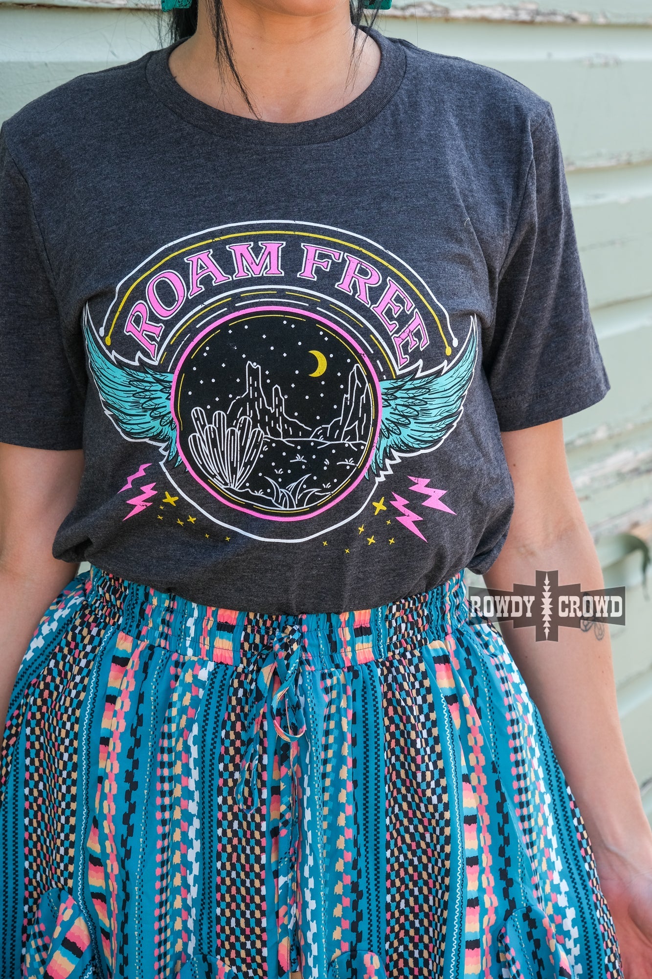 western apparel, western graphic tee, graphic western tees, wholesale clothing, western wholesale, women's western graphic tees, wholesale clothing and jewelry, western boutique clothing, western women's graphic tee, band style graphic tee, desert scene graphic tee, cactus, desert scene, bright graphic tee, colorful graphic tee, neon graphic tee, colorful western graphic tee, western desert scene graphic tee, roam free, band tee inspired