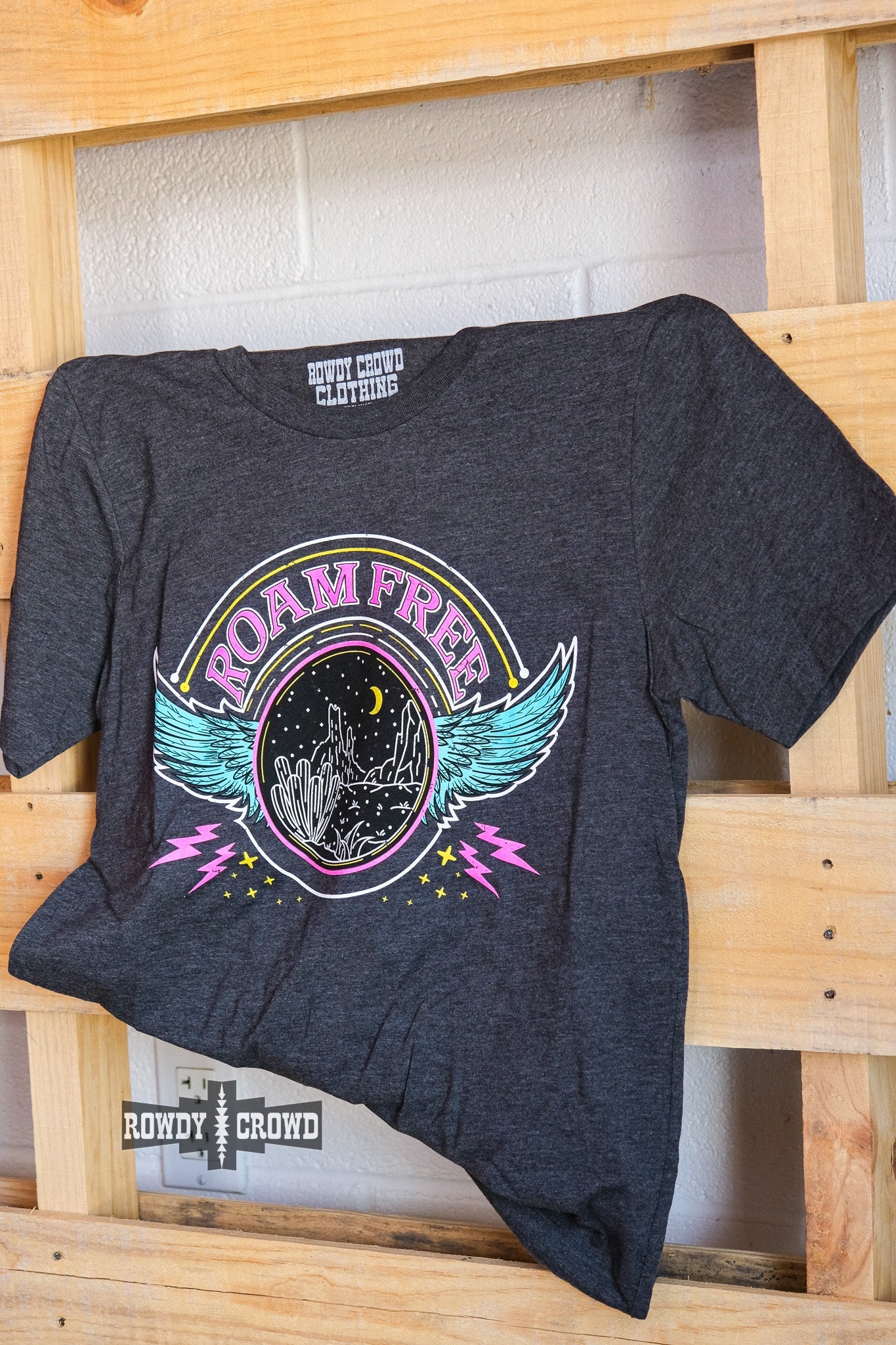 western apparel, western graphic tee, graphic western tees, wholesale clothing, western wholesale, women's western graphic tees, wholesale clothing and jewelry, western boutique clothing, western women's graphic tee, band style graphic tee, desert scene graphic tee, cactus, desert scene, bright graphic tee, colorful graphic tee, neon graphic tee, colorful western graphic tee, western desert scene graphic tee, roam free, band tee inspired